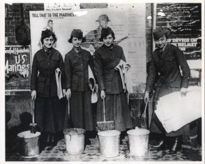 Pvt. Patterson (third from left) posting recruitment posters on Manhattan.